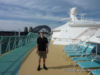 Michael on the top deck near the front of the ship